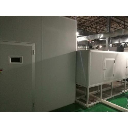 Industrial spray machine with UV dryer