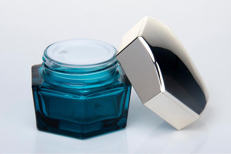 Blue glass hexagon cosmetic containers with silver cap